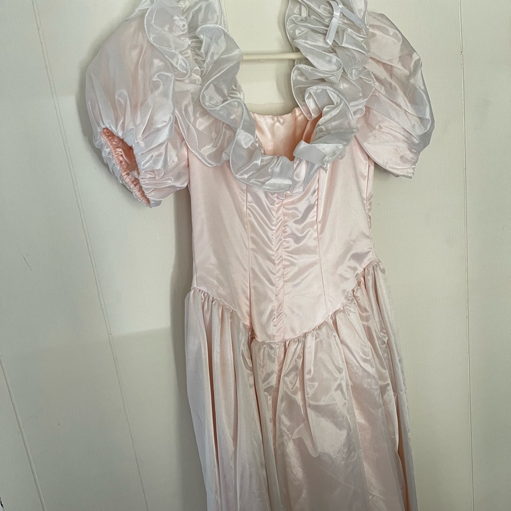 80’s prom pink dress with puffy sleeves.
